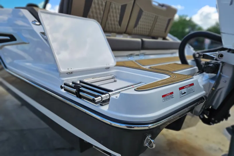 Slide: The Image of 2026 Monterey Elite 30 OB boat with open hatch and ladder on deck. - 6