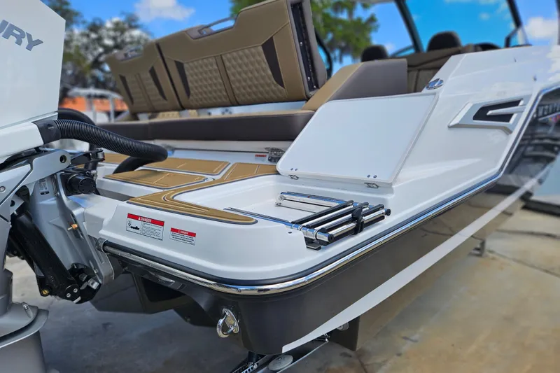 Slide: The Image of 2026 Monterey Elite 30 OB boat with sleek design and modern features. - 7