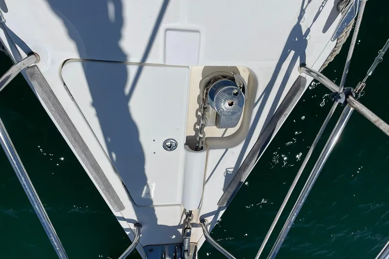 Slide: The Image of Bow of 2007 Beneteau Oceanis 46 sailboat with anchor chain and winch. - 32