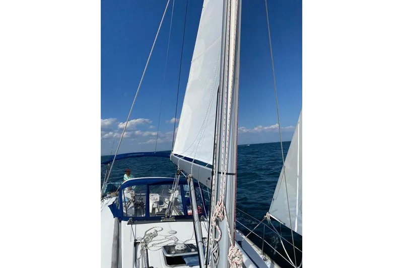 Slide: The Image of Sailing on a 2007 Beneteau Oceanis 46 yacht under clear blue skies. - 3