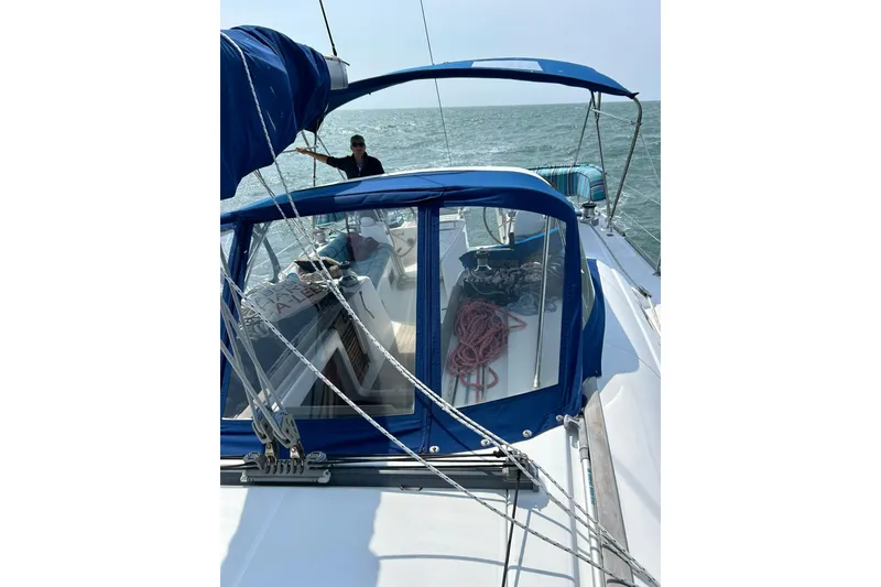 Slide: The Image of Sailing on a 2007 Beneteau Oceanis 46 yacht with blue canopy and ropes on deck. - 5