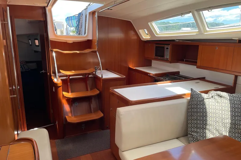 Slide: The Image of Interior of 2007 Beneteau Oceanis 46 yacht with wooden cabinetry and modern kitchen. - 26