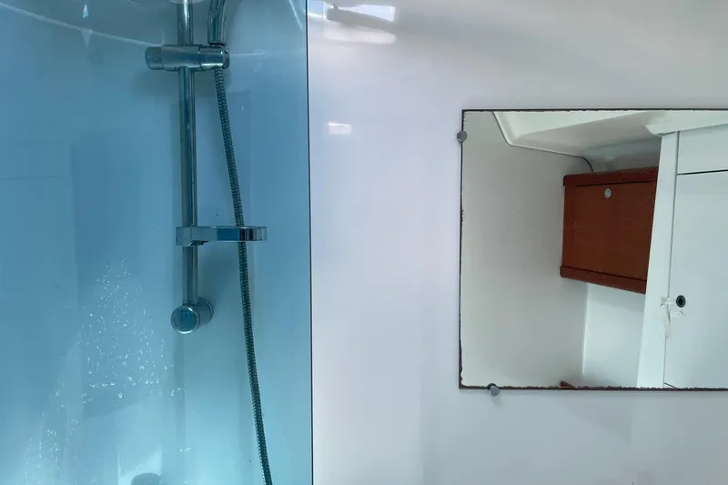 Slide: The Image of Bathroom interior of 2007 Beneteau Oceanis 46 yacht, featuring shower and mirror. - 14