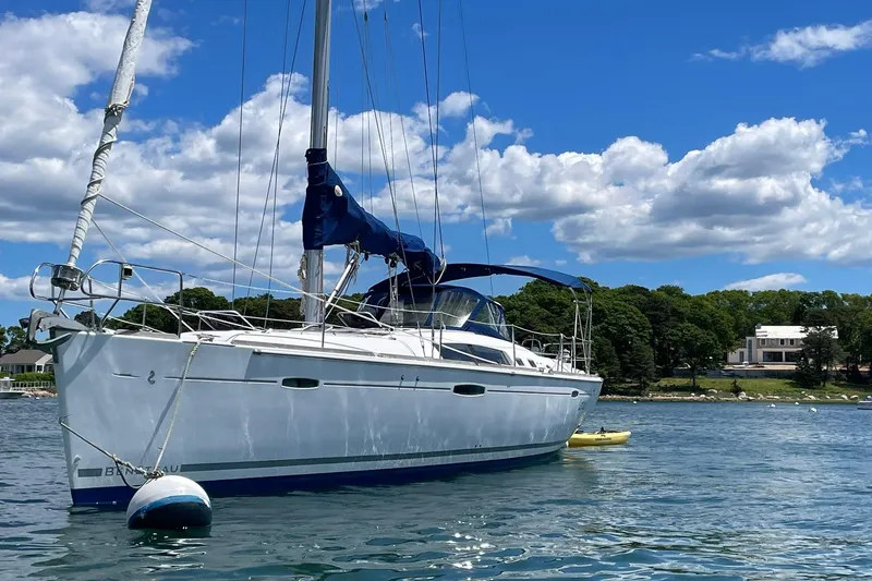 Slide: The Image of Sailboat Beneteau Oceanis 46, 2007 model, anchored on a sunny day with blue skies. - 39