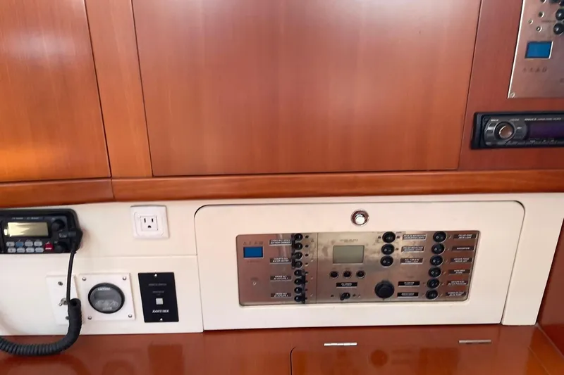 Slide: The Image of Control panel of a 2007 Beneteau Oceanis 46 yacht, featuring navigation and communication equipment. - 17