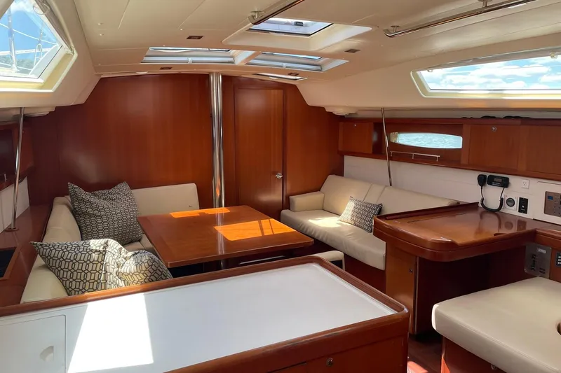 Slide: The Image of Luxurious interior of 2007 Beneteau Oceanis 46 yacht with elegant wood finish and plush seating. - 20