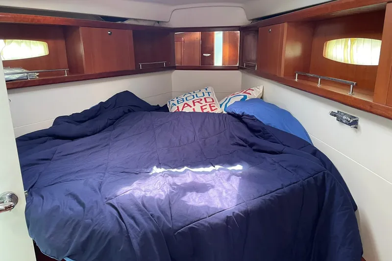 Slide: The Image of Cozy cabin interior of 2007 Beneteau Oceanis 46 sailboat with comfortable bedding. - 31