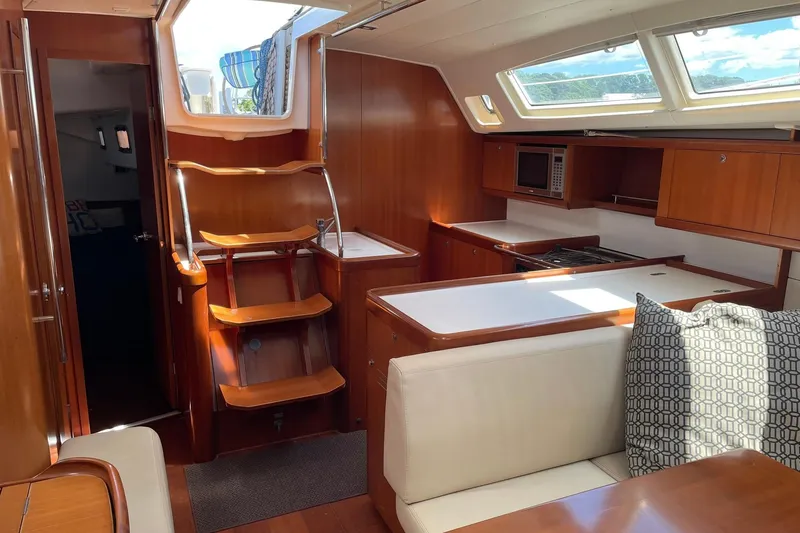 Slide: The Image of Interior of 2007 Beneteau Oceanis 46 yacht with wooden cabinetry and modern kitchen. - 28