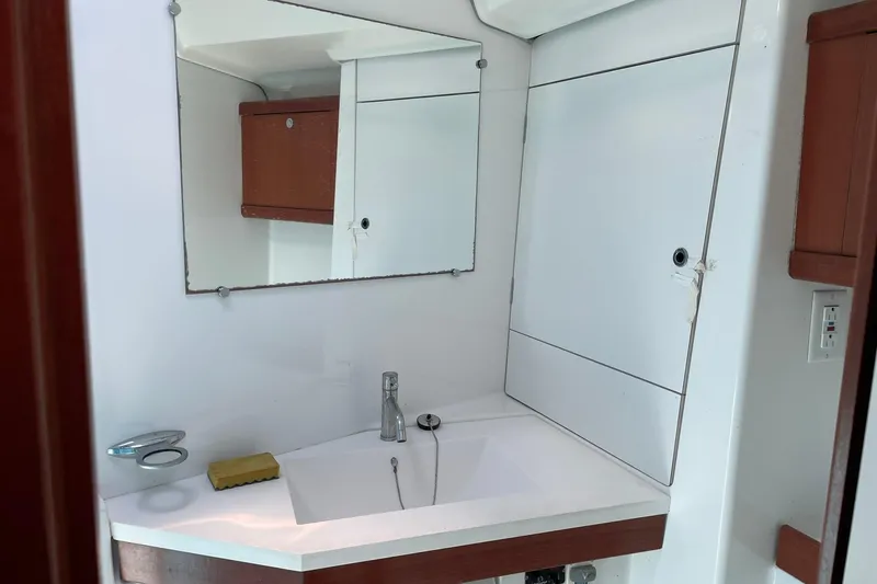 Slide: The Image of Bathroom interior of 2007 Beneteau Oceanis 46 yacht with mirror and sink. - 16