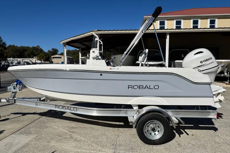 The Image of 2026 Robalo R160 Center Console boat on trailer, featuring Yamaha engine. - 0