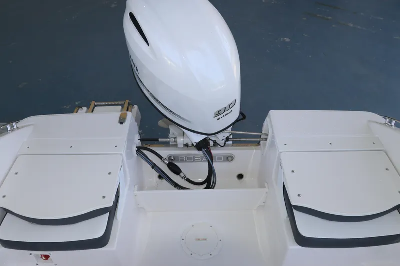 Slide: The Image of 2026 Robalo R160 Center Console boat with Yamaha outboard motor, rear view. - 10