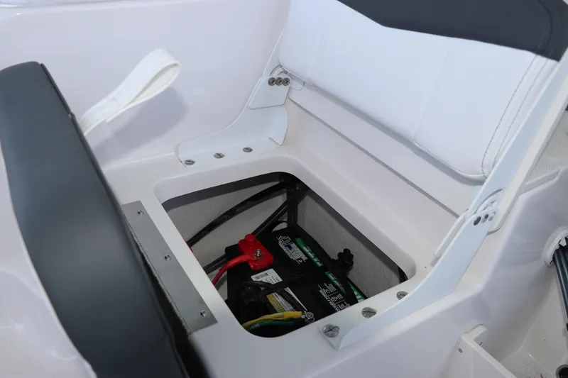 Slide: The Image of 2026 Robalo R160 Center Console boat battery compartment under seat. - 13