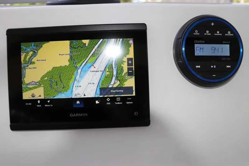 Slide: The Image of Garmin navigation and Clarion audio system on 2026 Robalo R160 Center Console boat. - 20