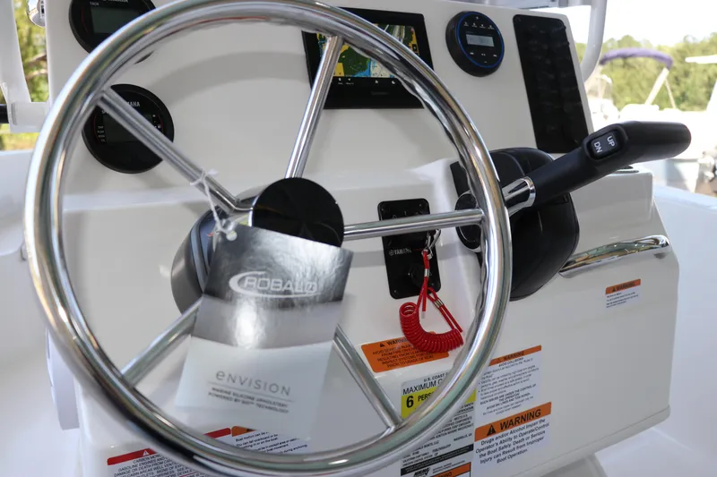 Slide: The Image of 2026 Robalo R160 Center Console steering wheel and controls, featuring modern dashboard design. - 22