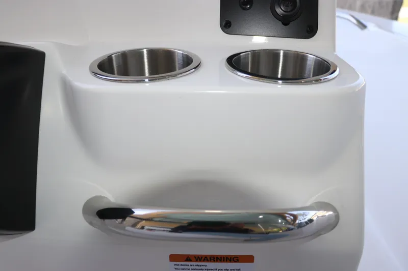 Slide: The Image of 2026 Robalo R160 Center Console boat cup holders and handle detail. - 23