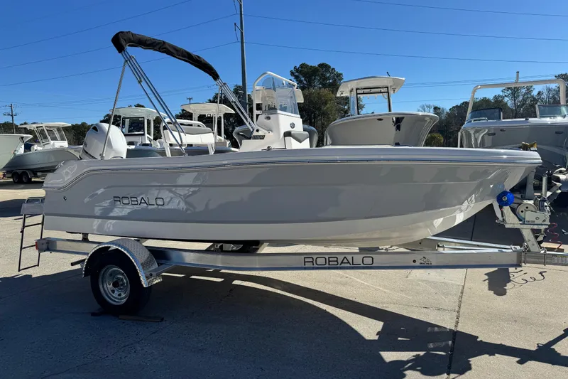 Slide: The Image of 2026 Robalo R160 Center Console boat on trailer, displayed outdoors. - 3