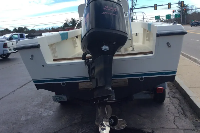 Slide: The Image of 1992 Pursuit 2150 Center Console boat with Mercury 225 engine on trailer. - 3