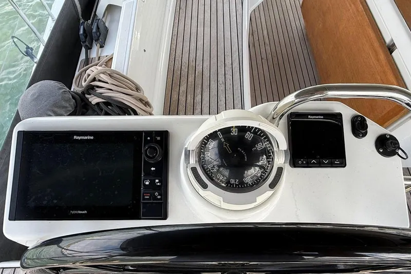 Slide: The Image of Cockpit of 2018 Jeanneau 51 yacht with navigation instruments and compass. - 19