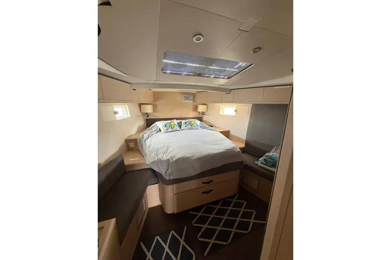Slide: The Image of Luxurious cabin interior of 2018 Jeanneau 51 yacht with cozy bed and modern decor. - 25