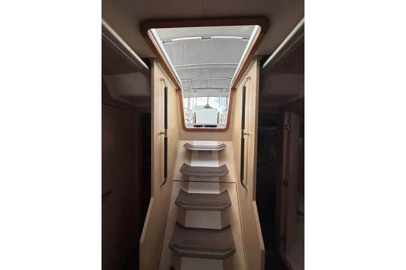 Slide: The Image of Interior stairs of 2018 Jeanneau 51 yacht, leading to deck hatch. - 27