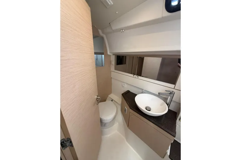 Slide: The Image of Modern bathroom interior of 2018 Jeanneau 51 yacht, featuring sleek sink and compact design. - 29