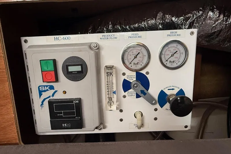 Slide: The Image of Control panel of HC-600 watermaker on 2018 Jeanneau 51 yacht, featuring gauges and switches. - 33