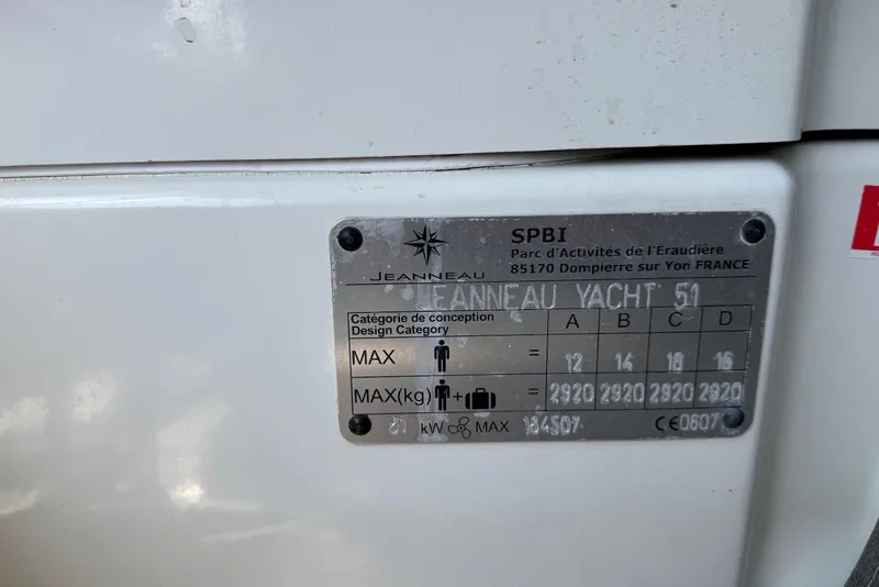 Slide: The Image of Plaque on 2018 Jeanneau 51 yacht displaying design category and weight limits. - 34