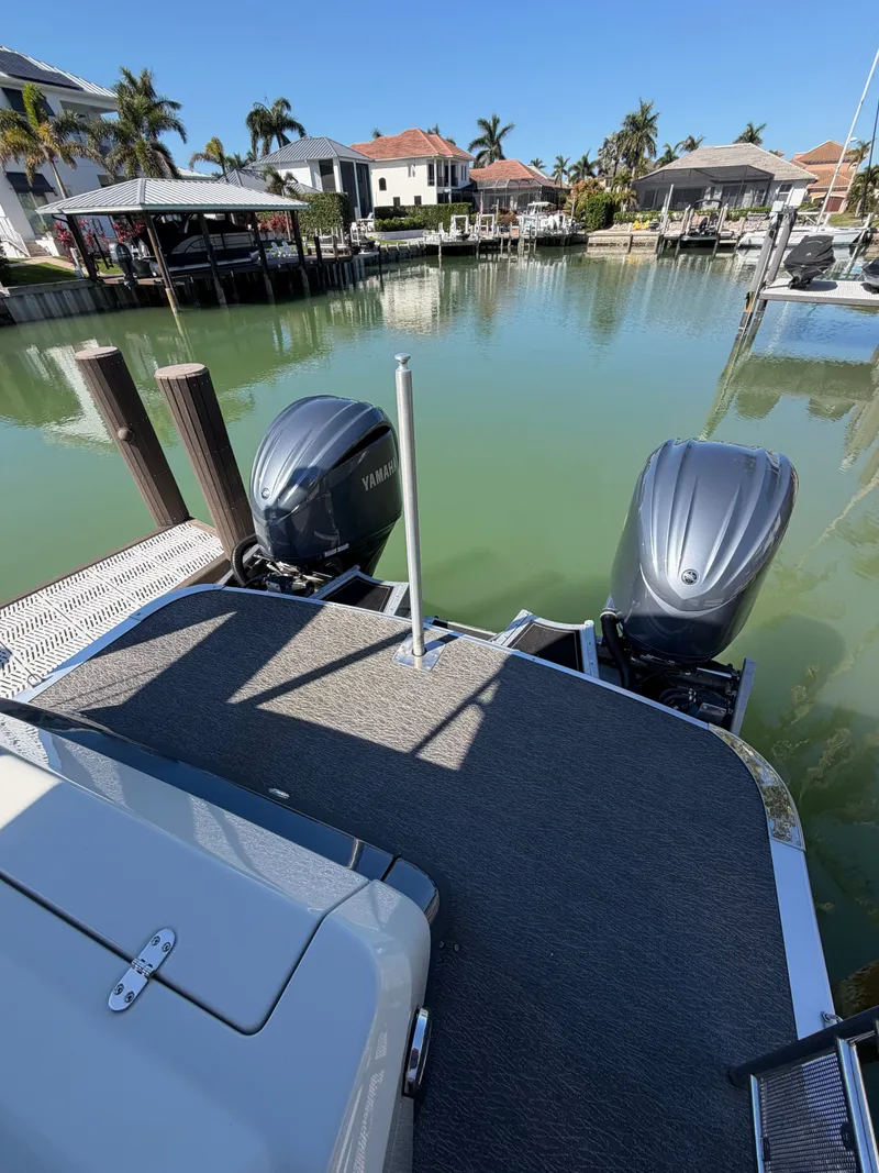 Slide: The Image of 2021 Avalon Excalibur Twin Elite Pontoon at dock with Yamaha engines. - 8