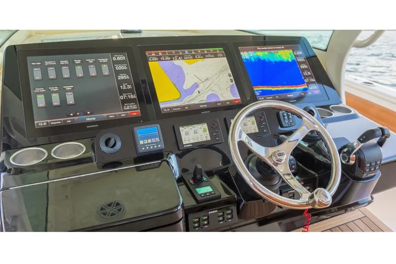 Slide: The Image of Manufacturer Provided Image: 2017 Scout 420 LXF boat dashboard with navigation and control screens. - 5
