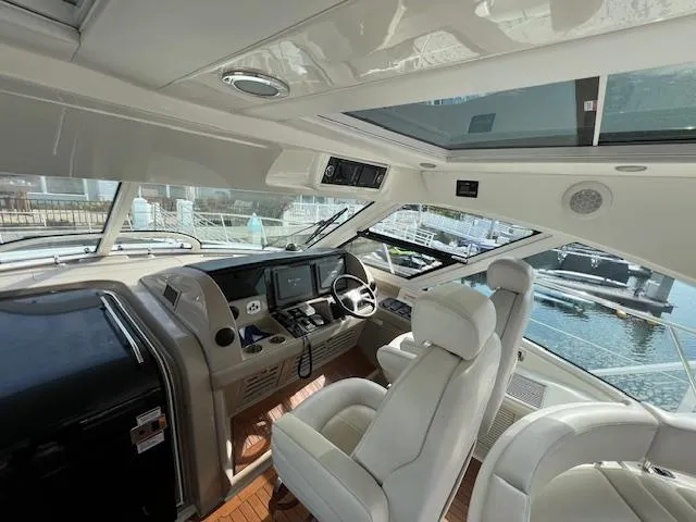 Slide: The Image of Interior of 2008 Sea Ray 55 Sundancer yacht with helm and seating area. - 18