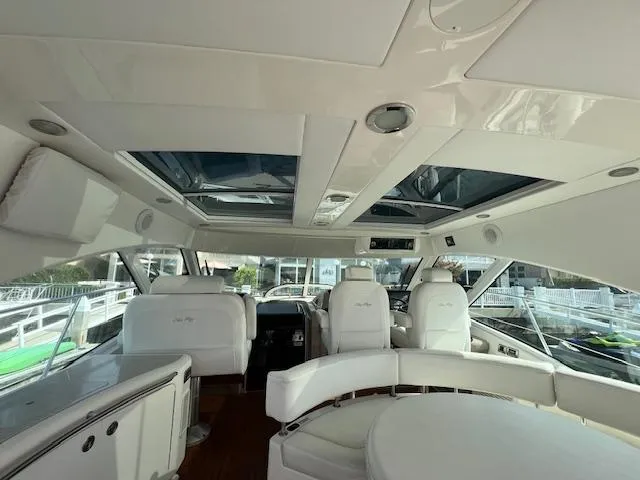 Slide: The Image of Interior of 2008 Sea Ray 55 Sundancer yacht with white seating and panoramic windows. - 20