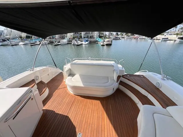 Slide: The Image of 2008 Sea Ray 55 Sundancer yacht with spacious teak deck and marina view. - 21