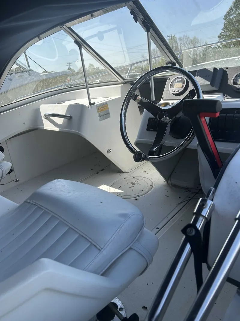 Slide: The Image of Interior of a 1999 Boston Whaler Ventura 16 boat. - 3