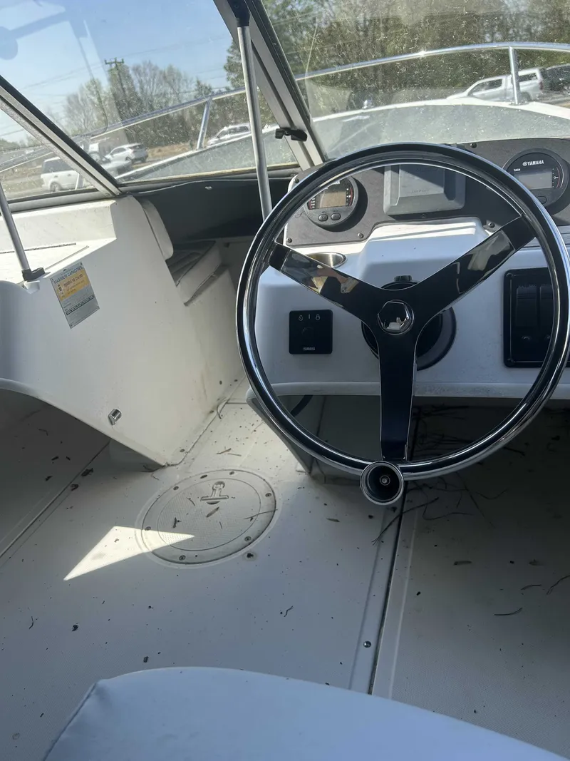 Slide: The Image of Interior view of a 1999 Boston Whaler Ventura 16 boat. - 4