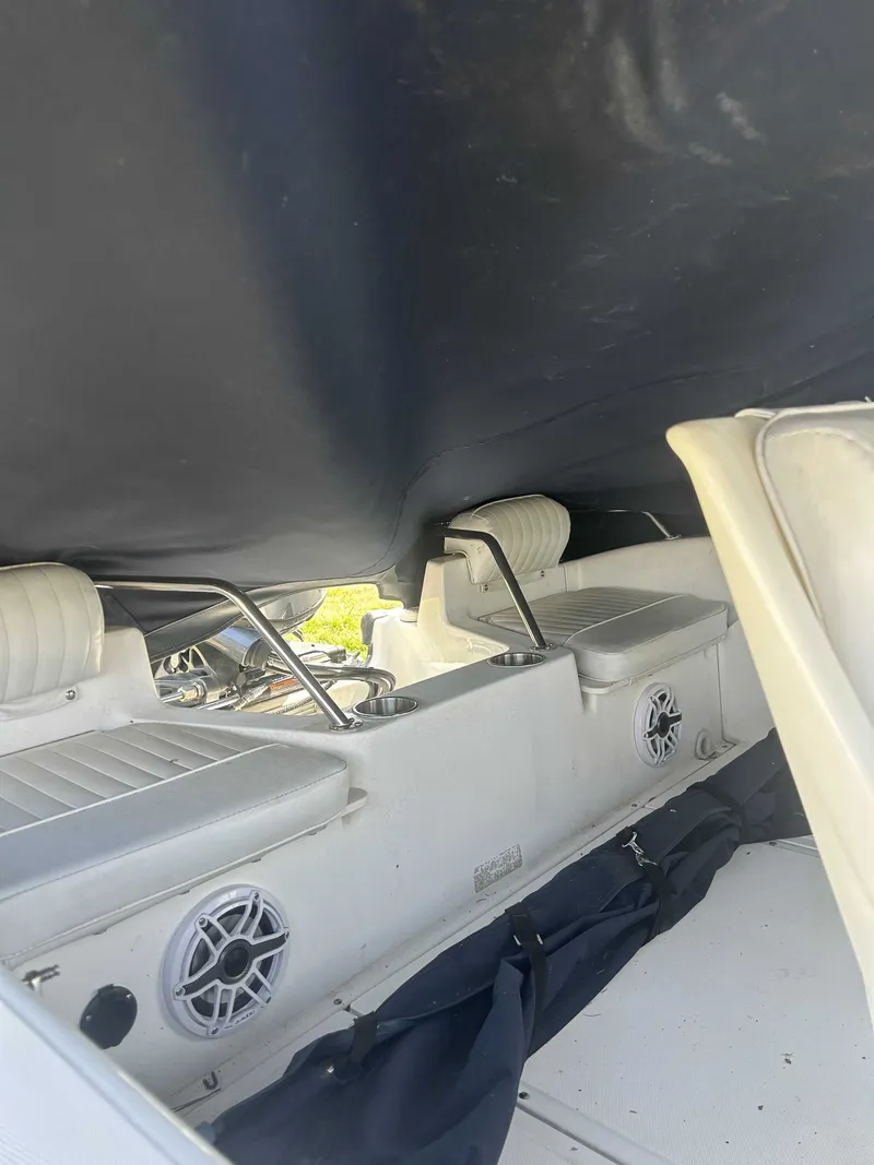 Slide: The Image of Interior of a 1999 Boston Whaler Ventura 16 boat with seating. - 5
