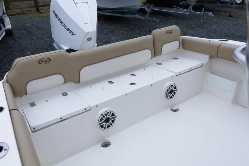 Slide: The Image of 2020 Key West 239 FS boat interior with seating and Mercury engine. - 12