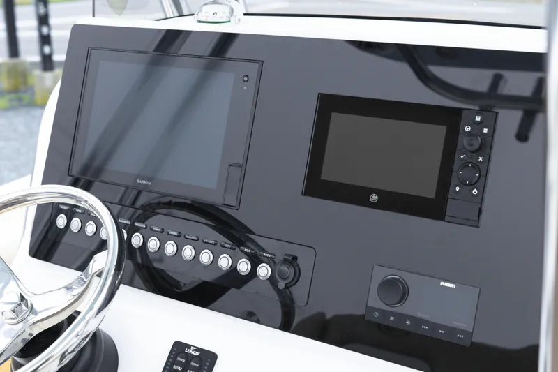 Slide: The Image of 2020 Key West 239 FS boat dashboard with Garmin navigation and control panel. - 14