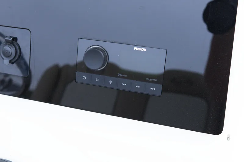 Slide: The Image of Control panel of a 2020 Key West 239 FS boat featuring a Fusion audio system. - 15