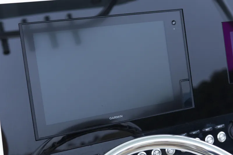 Slide: The Image of Garmin display on 2020 Key West 239 FS boat dashboard with steering wheel. - 17