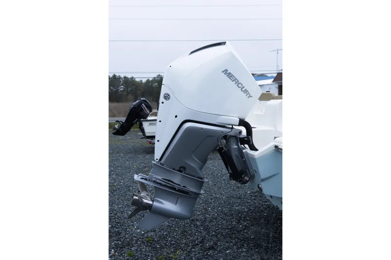 Slide: The Image of 2020 Key West 239 FS boat with Mercury outboard motor on gravel surface. - 5