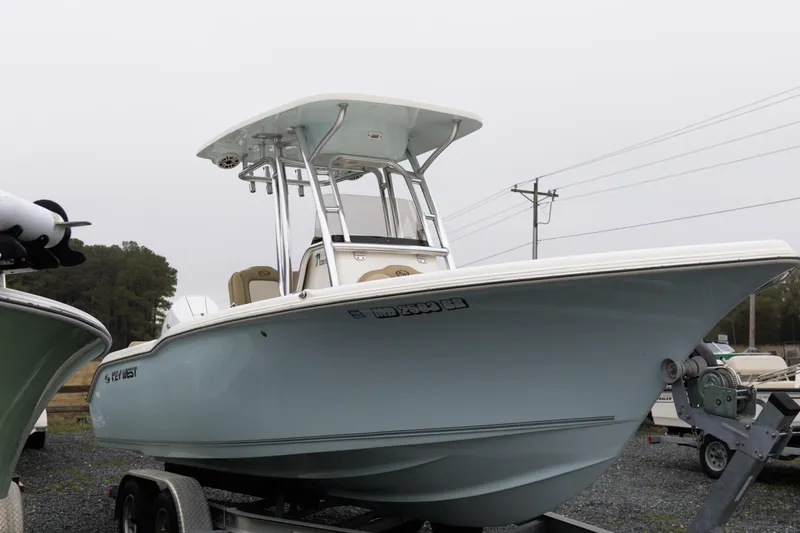Slide: The Image of 2020 Key West 239 FS boat on trailer, overcast day, side view. - 7