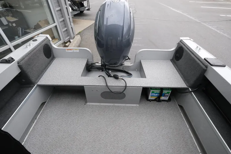 Slide: The Image of 2023 SMOKERCRAFT 172 Osprey boat interior with motor and battery storage. - 14