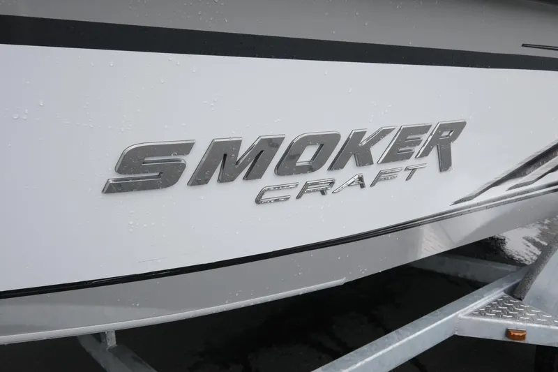Slide: The Image of 2023 SMOKERCRAFT 172 Osprey boat logo on a wet surface. - 4