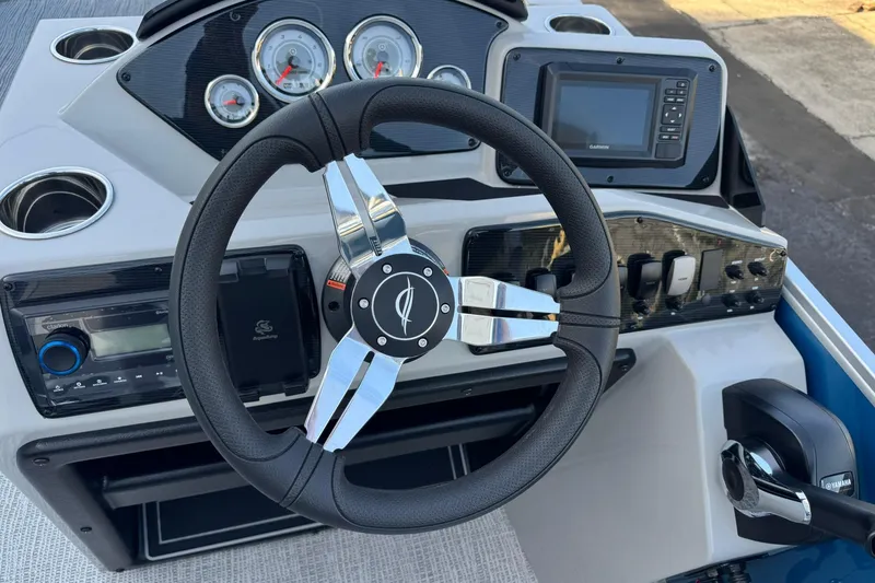 Slide: The Image of Steering console of 2026 SunCatcher Select 22RF boat with modern controls and gauges. - 13