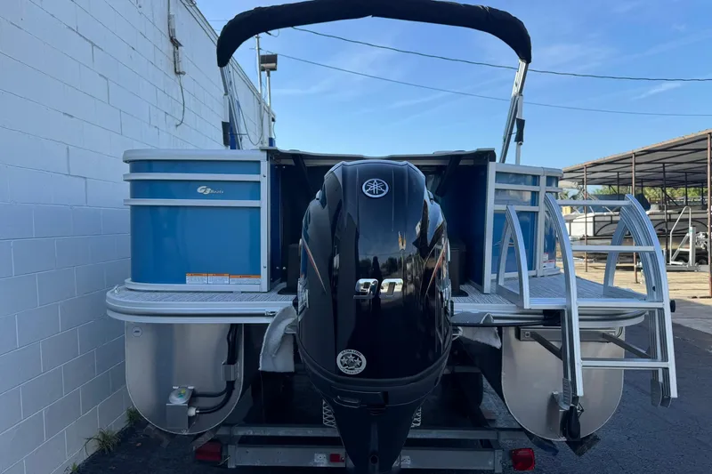 Slide: The Image of 2026 SunCatcher Select 22RF pontoon boat with Yamaha outboard motor, docked outdoors. - 8
