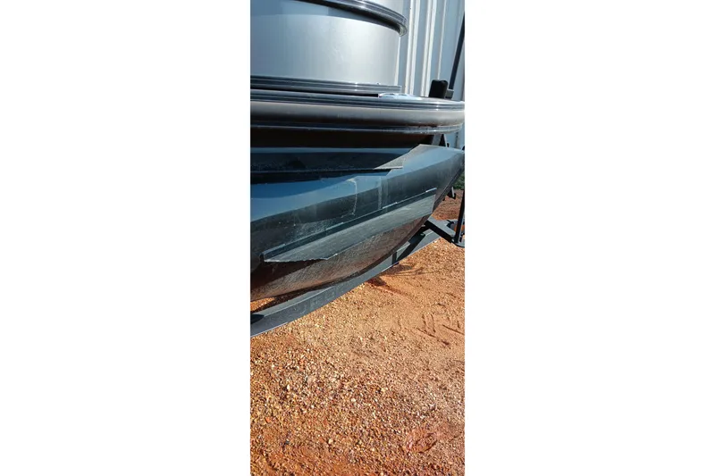 Slide: The Image of 2023 Ranger 2500LS boat hull on gravel surface. - 11