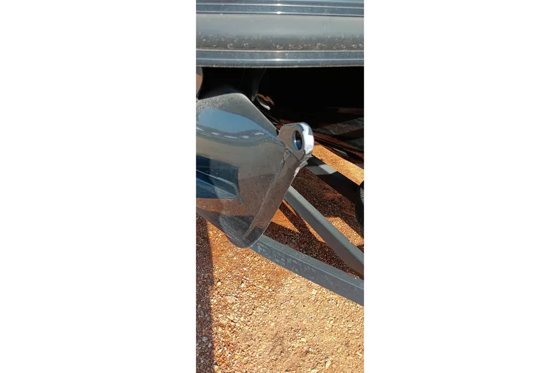 Slide: The Image of Close-up of a 2023 Ranger 2500LS boat propeller on a gravel surface. - 12