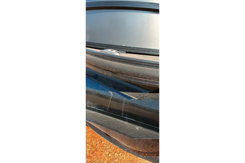 Slide: The Image of Close-up of a 2023 Ranger 2500LS boat detail on a sunny day. - 13
