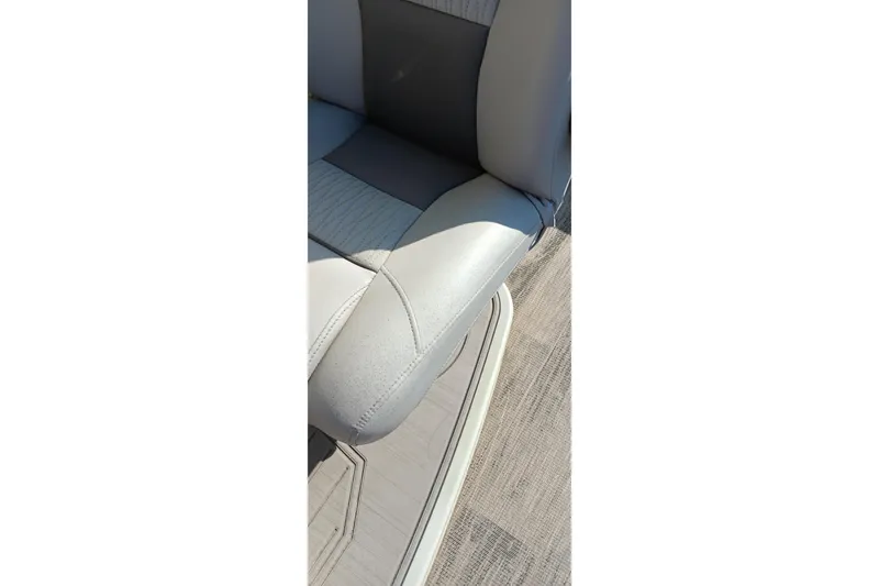 Slide: The Image of 2023 Ranger 2500LS boat seat with gray and white upholstery. - 31