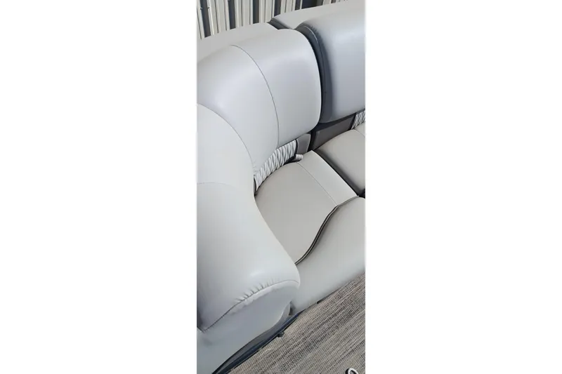 Slide: The Image of 2023 Ranger 2500LS boat interior with gray cushioned seating. - 36